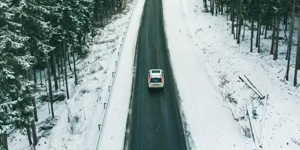 Car driving on a snowy road