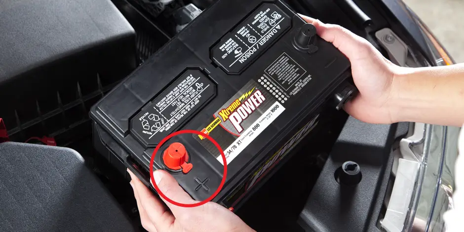 Car battery with focus on the positive terminal