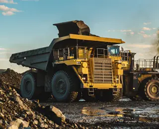 Dumptruck and loader on mining site