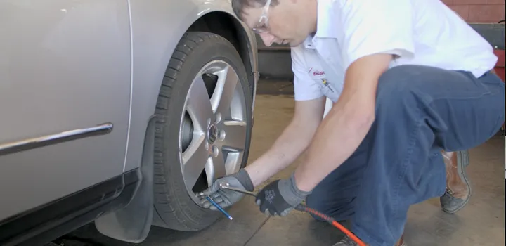 Checking tire pressure on tire