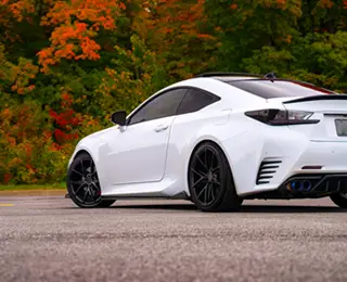 Lowered white sports car in parking lot