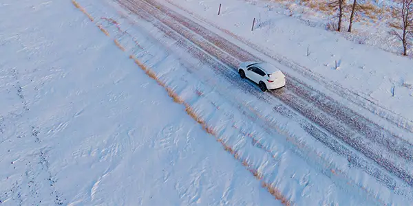 Car driving on a snowy road